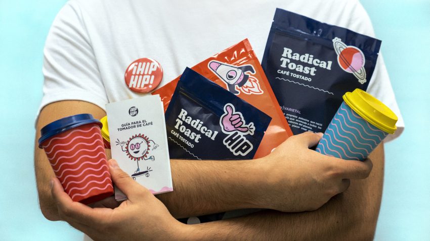 A man holds a variety of branded items.